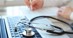 Stethoscope on top of laptop keyboard