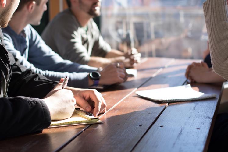 Group of people discussing at a table