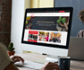 Photo of someone scrolling on IFMA's new website on their desktop